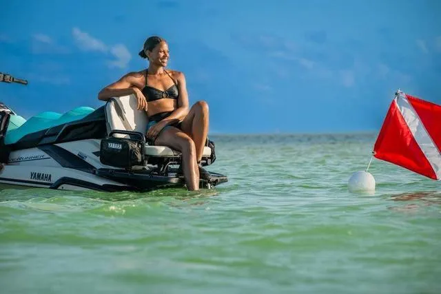 Slide: The Image of Woman relaxing on 2025 Yamaha Waverunner FX Cruiser HO in clear ocean water. - 18