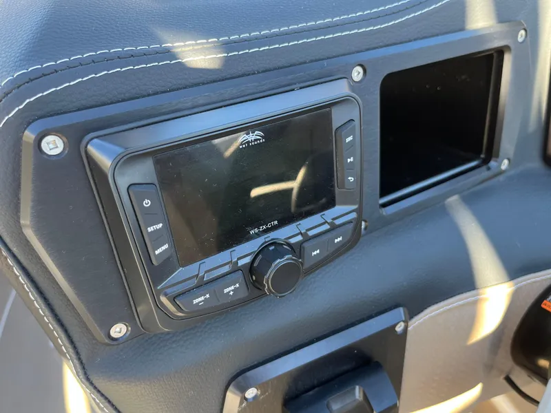 Slide: The Image of Dashboard of a 2025 Centurion Fe25 boat with a control panel. - 16