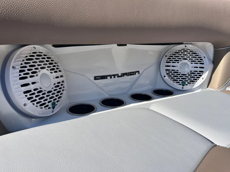 Slide: The Image of Centurion Fe25 2025 boat interior with dual speakers and cup holders. - 18