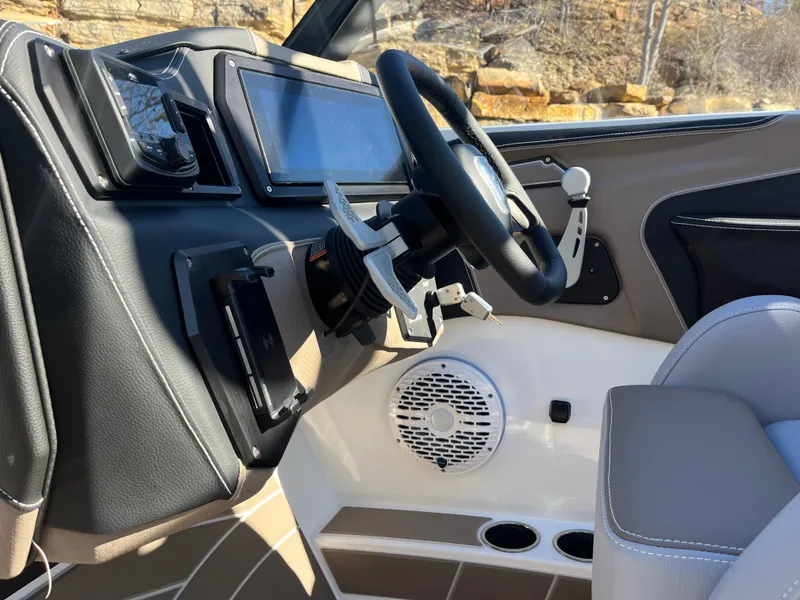 Slide: The Image of Interior of 2025 Centurion Fe25 boat, featuring modern dashboard and steering wheel. - 19