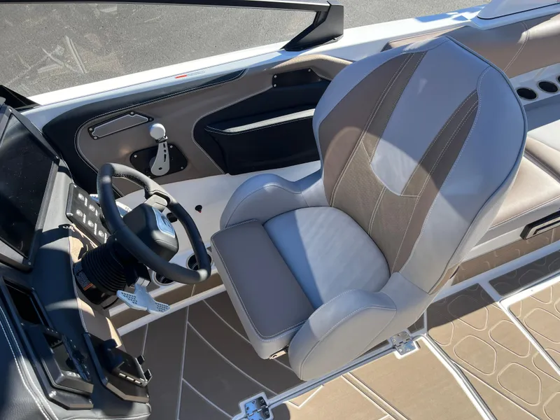 Slide: The Image of 2025 Centurion Fe25 boat interior with modern steering and comfortable seating. - 20