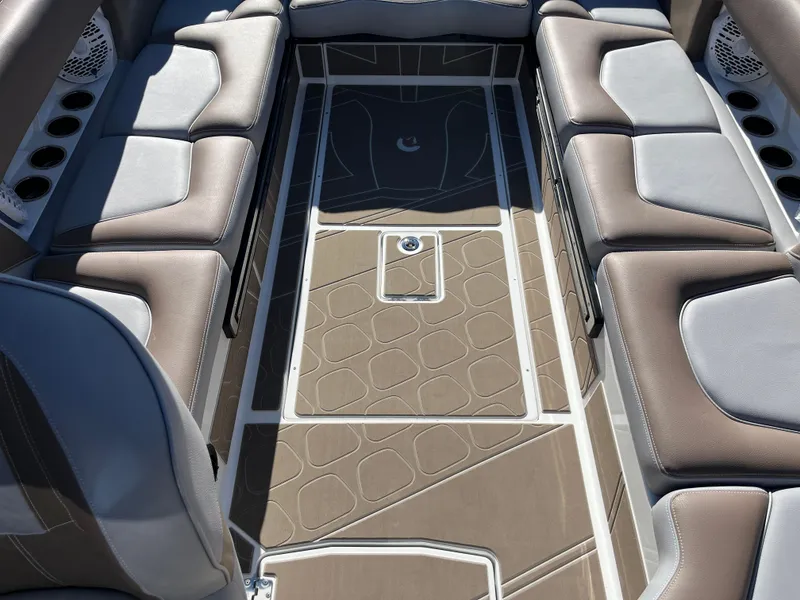 Slide: The Image of Centurion Fe25 2025 boat interior with cushioned seating and stylish flooring design. - 25