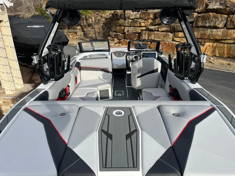 Slide: The Image of 2025 Centurion NV233 boat interior with modern seating and sleek design. - 17