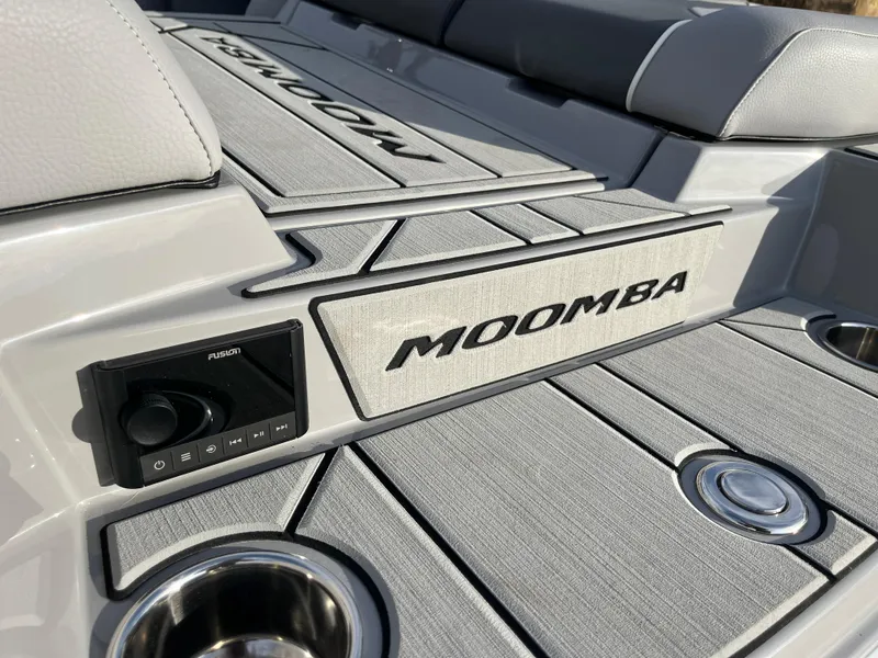 Slide: The Image of 2025 Moomba Makai boat interior with branded seating and audio controls. - 15