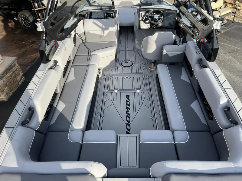 Slide: The Image of 2025 Moomba Makai boat interior with spacious seating and modern design. - 16