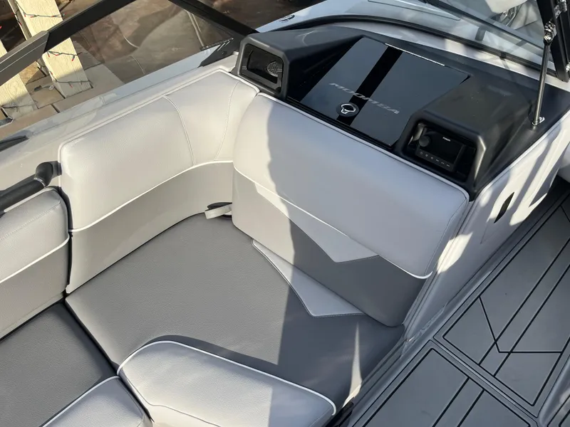 Slide: The Image of 2025 Moomba Makai boat interior with sleek gray seating and modern dashboard design. - 19