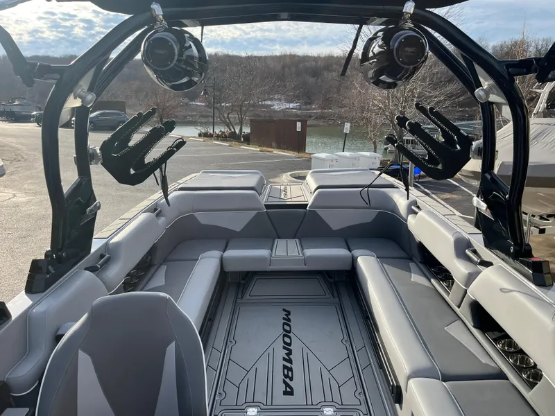 Slide: The Image of 2025 Moomba Makai boat interior with spacious seating and advanced audio system. - 20