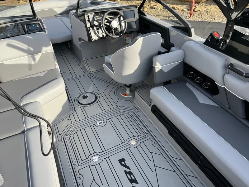 Slide: The Image of 2025 Moomba Makai boat interior with modern seating and steering console. - 23