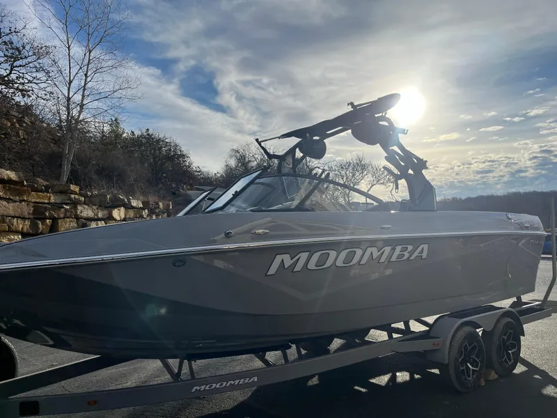 Slide: The Image of 2025 Moomba Makai boat on trailer under a bright sky. - 5