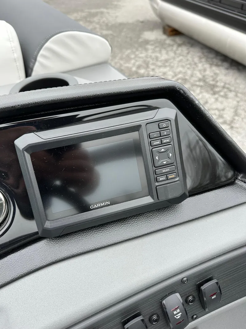 Slide: The Image of Garmin display on 2025 Bennington 22 SSR Quad Bench Tritoon dashboard. - 11