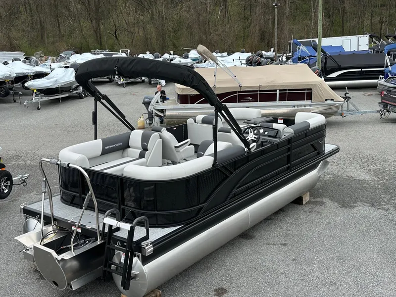 Slide: The Image of 2025 Bennington 22 SSR Quad Bench Tritoon with Yamaha F-150HP, parked in a marina. - 17