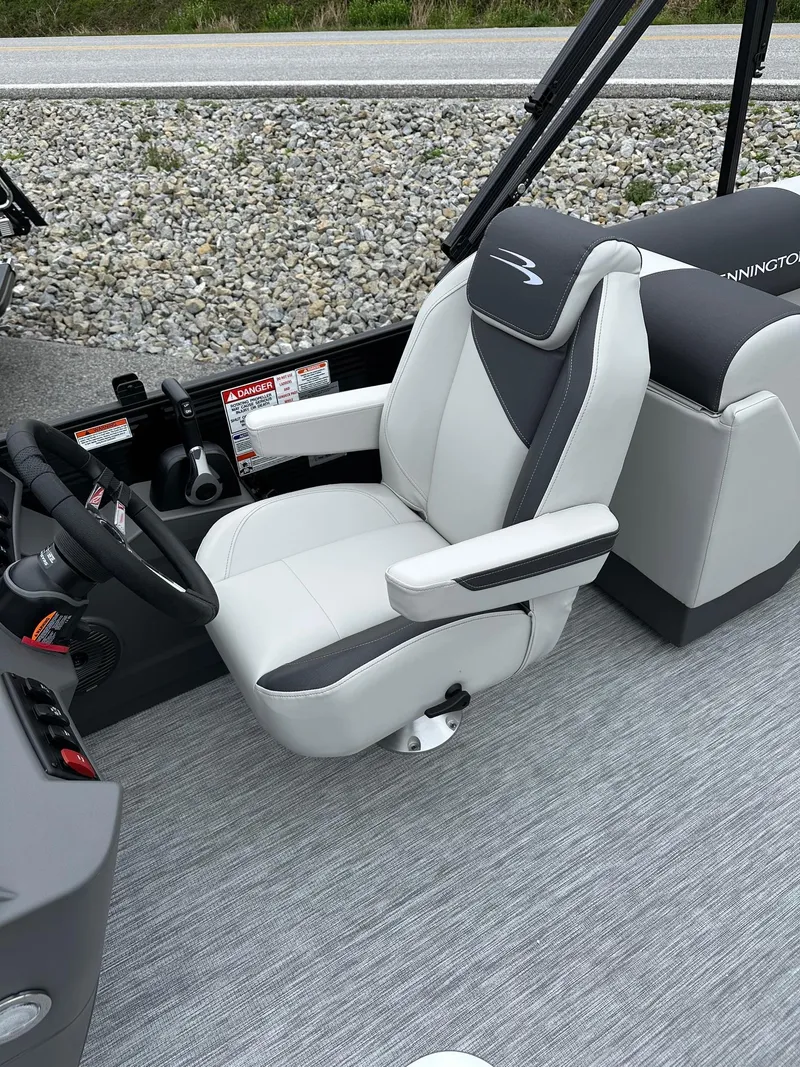 Slide: The Image of 2025 Bennington 22 SSR Tritoon captain's chair with sleek design and comfortable seating. - 26