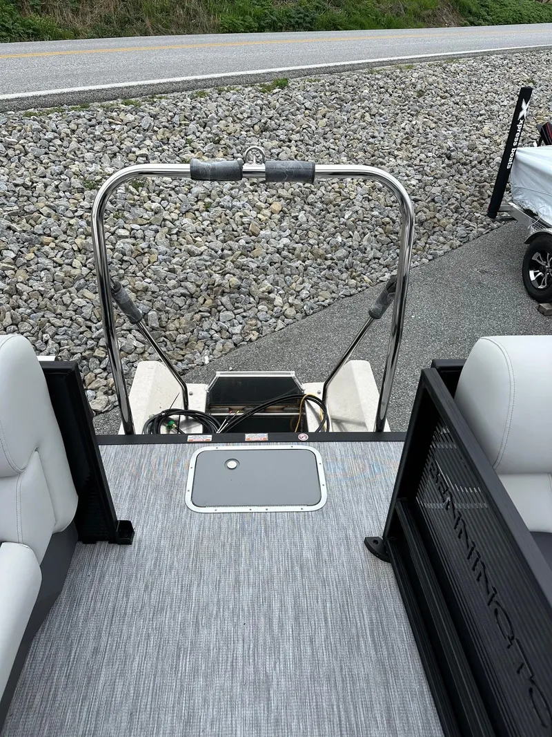 Slide: The Image of 2025 Bennington 22 SSR Quad Bench Tritoon interior with Yamaha F-150HP engine. - 32