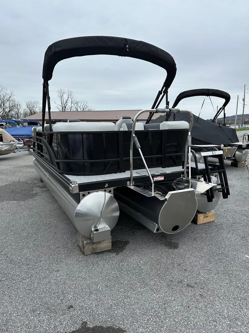 Slide: The Image of 2025 Bennington 22 SSR Quad Bench Tritoon with Yamaha F-150HP, docked on a lot. - 36