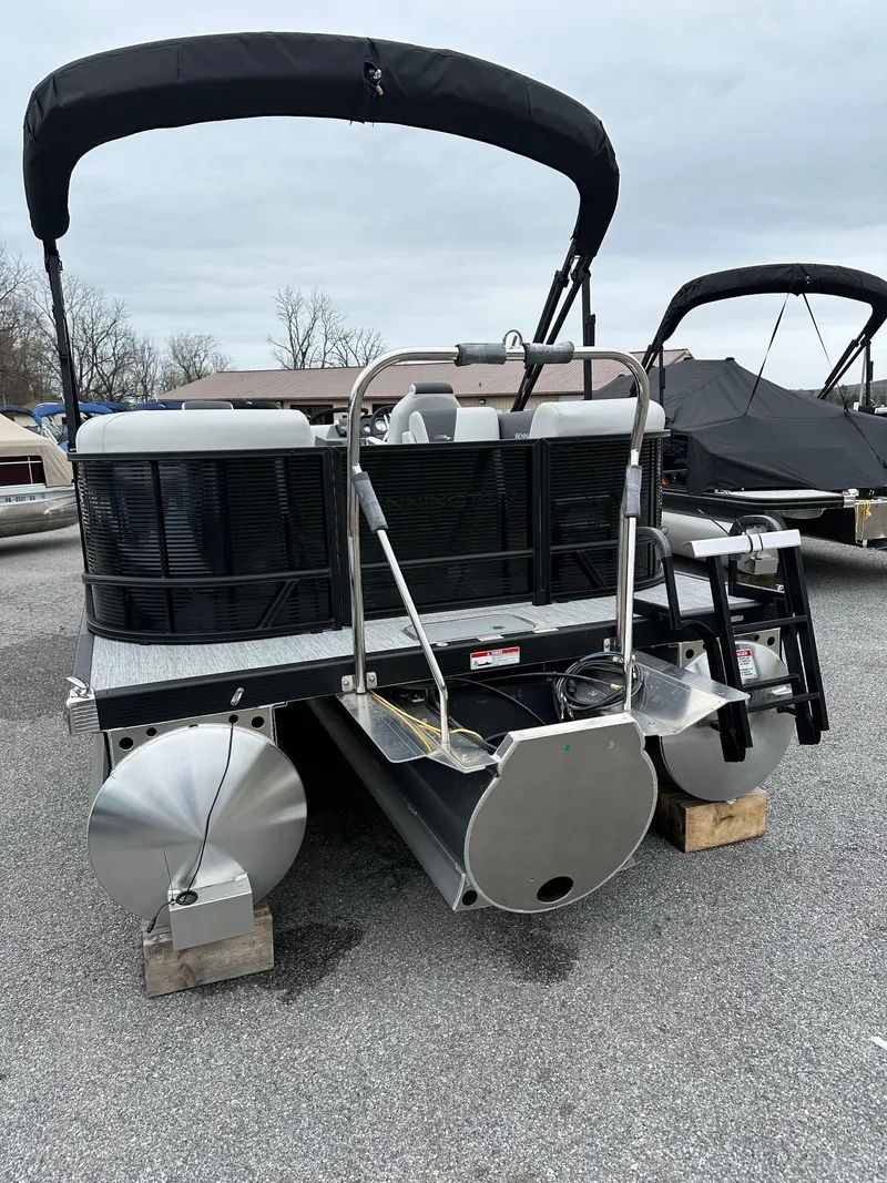Slide: The Image of 2025 Bennington 22 SSR Quad Bench Tritoon with Yamaha F-150HP, parked on a lot. - 5
