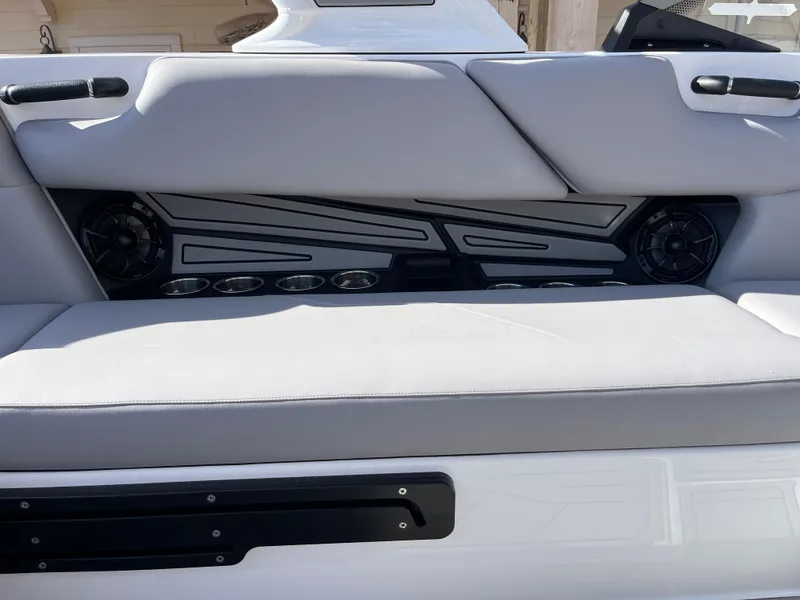 Slide: The Image of 2025 Moomba Max boat interior with sleek seating and integrated speakers. - 12