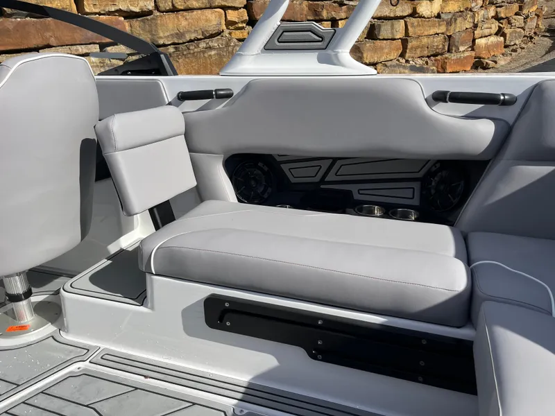 Slide: The Image of 2025 Moomba Max boat interior with gray seating and modern design elements. - 13
