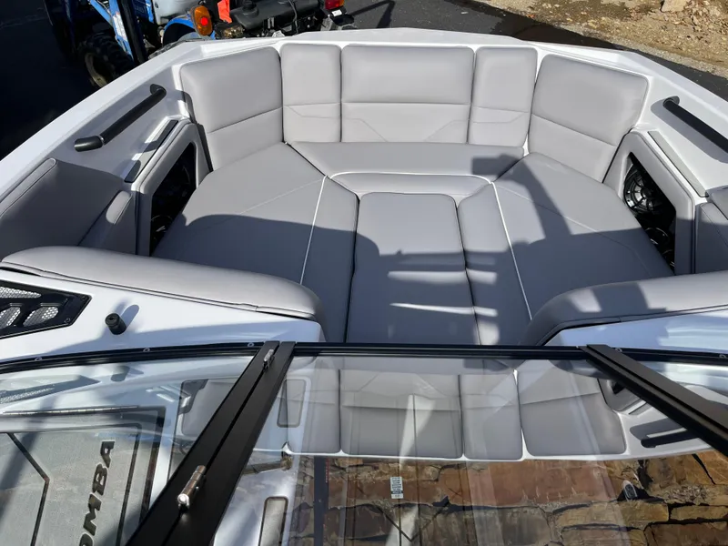 Slide: The Image of 2025 Moomba Max boat interior with gray seating and modern design. - 15