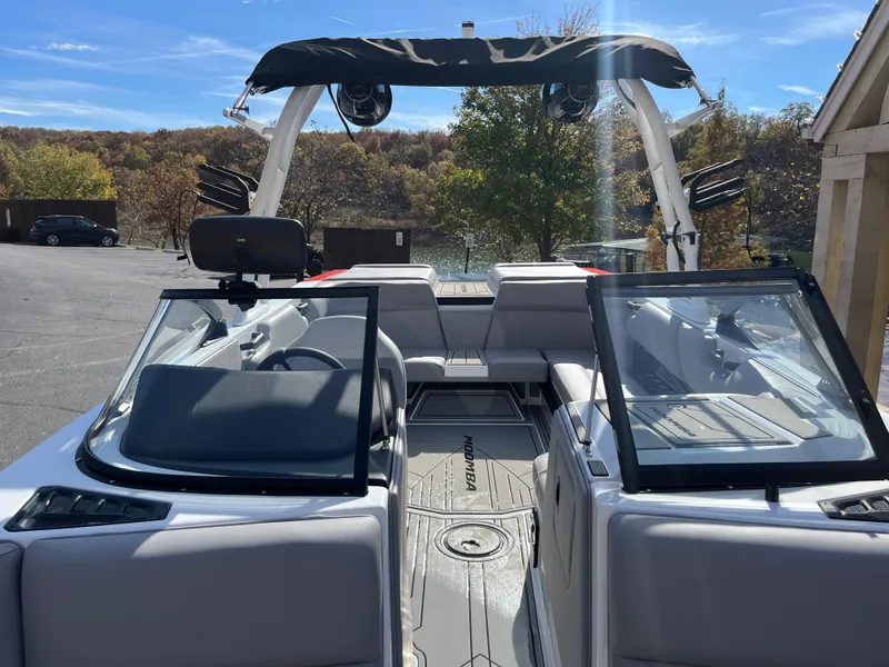 Slide: The Image of 2025 Moomba Max boat interior with open seating and sleek design. - 19