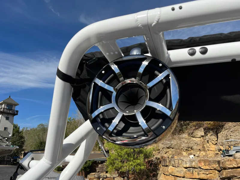 Slide: The Image of 2025 Moomba Max boat speaker on a white frame, outdoor setting. - 21