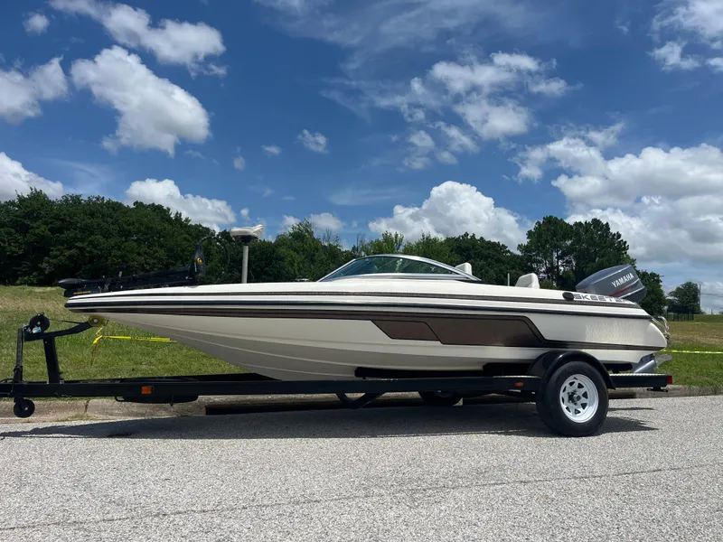 Slide: The Image of 1998 Skeeter 176 SL C boat on trailer under blue sky. - 1