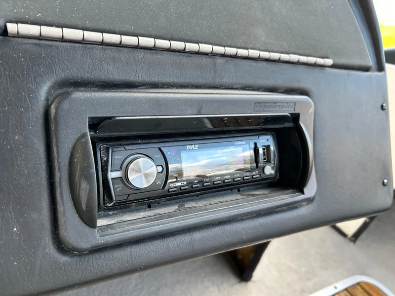 Slide: The Image of 1998 Skeeter 176 SL C dashboard with Pyle stereo system installed. - 10