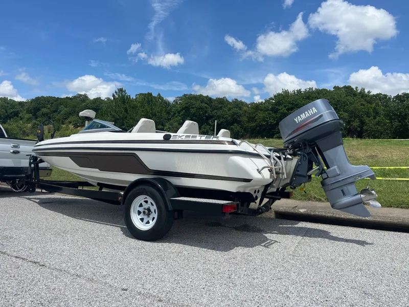 Slide: The Image of 1998 Skeeter 176 SL C boat with Yamaha outboard motor on trailer. - 3