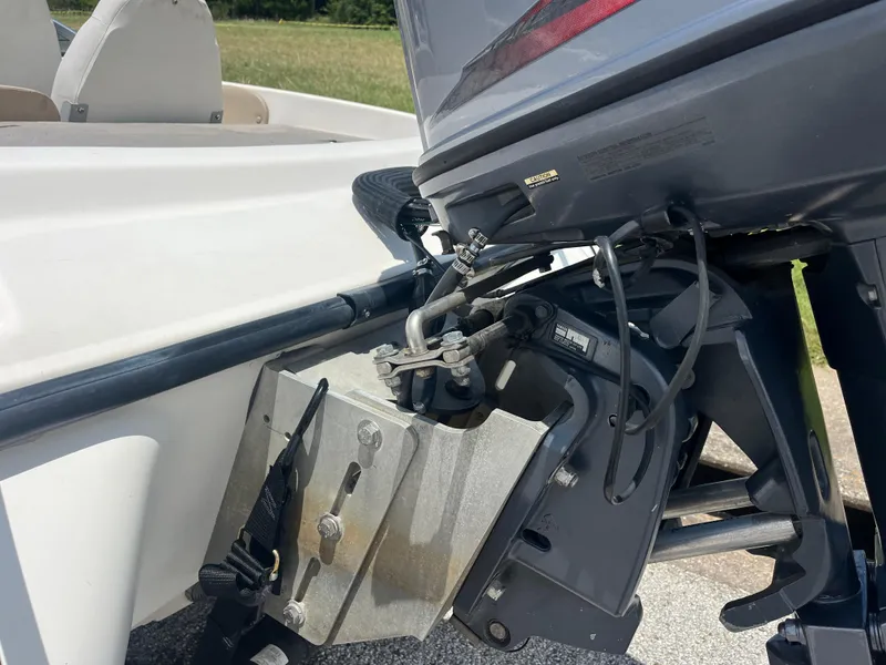 Slide: The Image of 1998 Skeeter 176 SL C boat motor and mounting bracket close-up. - 39