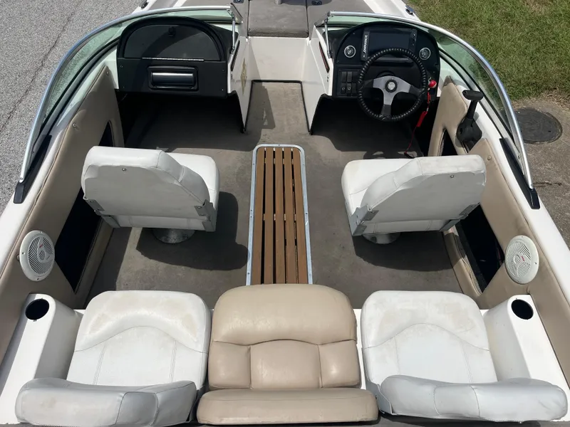 Slide: The Image of 1998 Skeeter 176 SL C boat interior with white seating and steering wheel. - 4