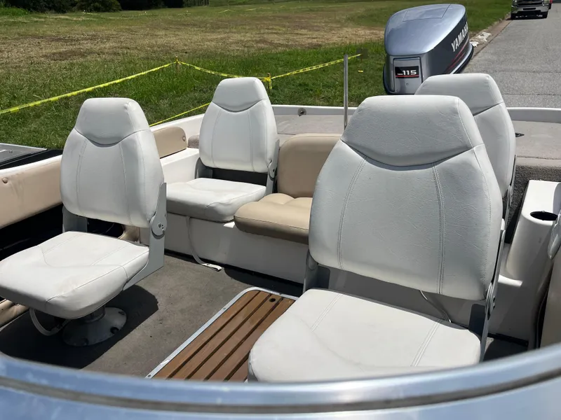 Slide: The Image of 1998 Skeeter 176 SL C boat interior with white seating and Yamaha 115 outboard motor. - 5