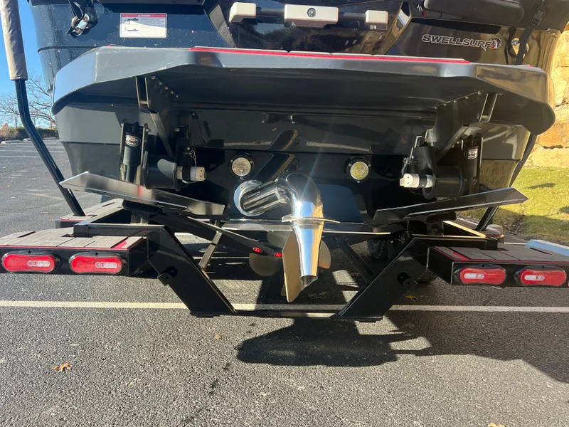 Slide: The Image of Rear view of 2022 Supra SE boat with propeller and trailer. - 23
