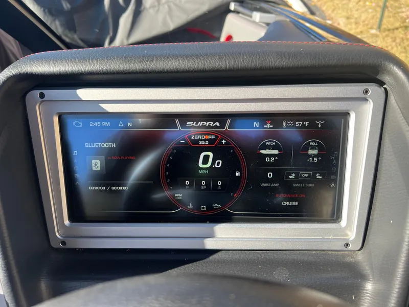 Slide: The Image of 2022 Supra SE dashboard display with digital speedometer and Bluetooth connectivity. - 24