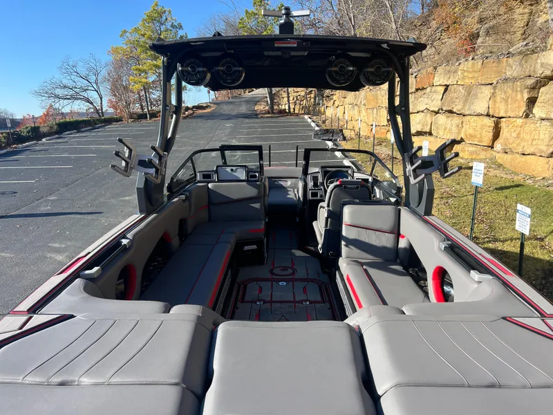 Slide: The Image of 2022 Supra SE boat interior with gray seating and advanced audio system. - 8