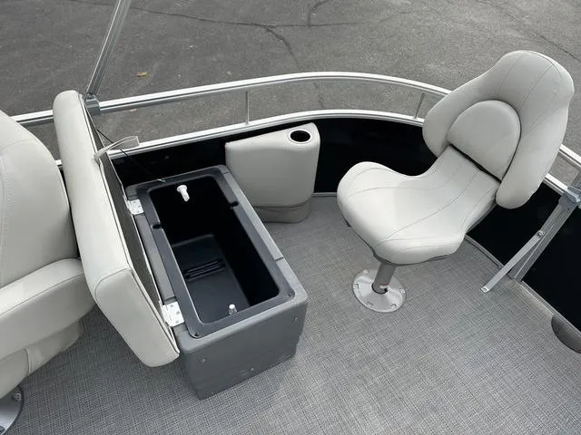 Slide: The Image of 2024 Starcraft LX 20 F boat interior with seating and storage compartment. - 10