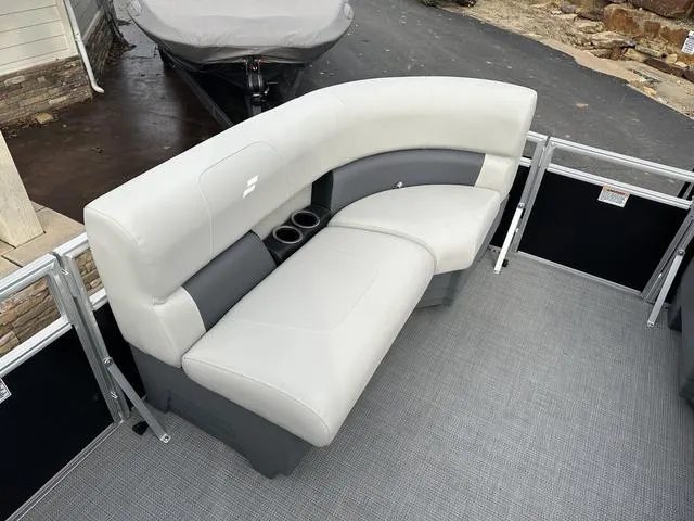 Slide: The Image of 2024 Starcraft LX 20 F boat seating with cup holders, featuring gray upholstery and modern design. - 15