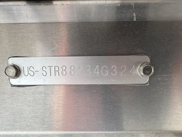 Slide: The Image of 2024 Starcraft LX 20 F metal identification plate with serial number. - 20