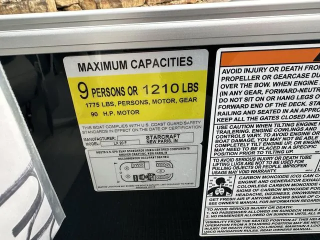 Slide: The Image of 2024 Starcraft LX 20 F capacity label: 9 persons or 1210 lbs, 90 HP motor. - 21
