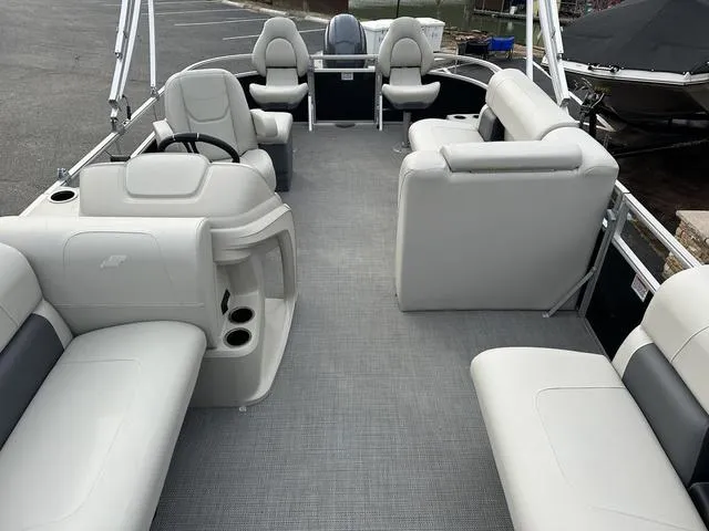 Slide: The Image of 2024 Starcraft LX 20 F pontoon boat interior with spacious seating and modern design. - 8