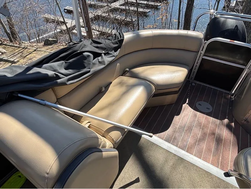 Slide: The Image of 2014 South Bay 523E pontoon boat with beige seating and wood-style flooring. - 10