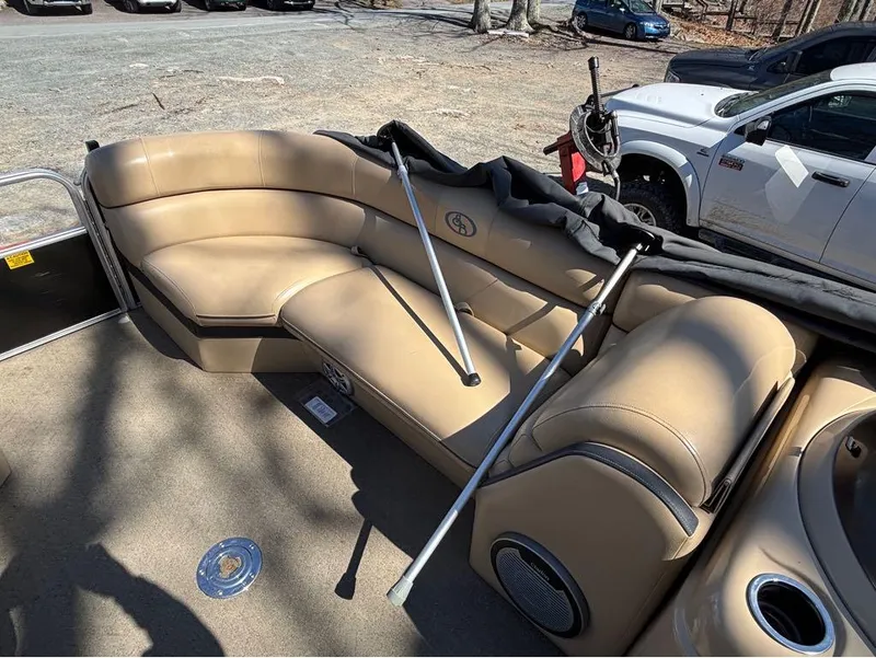 Slide: The Image of 2014 South Bay 523E boat interior with tan seating and speaker system. - 11