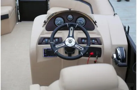 Slide: The Image of 2019 South Bay 200 Series 224RS 2.75 boat dashboard with steering wheel and controls. - 4