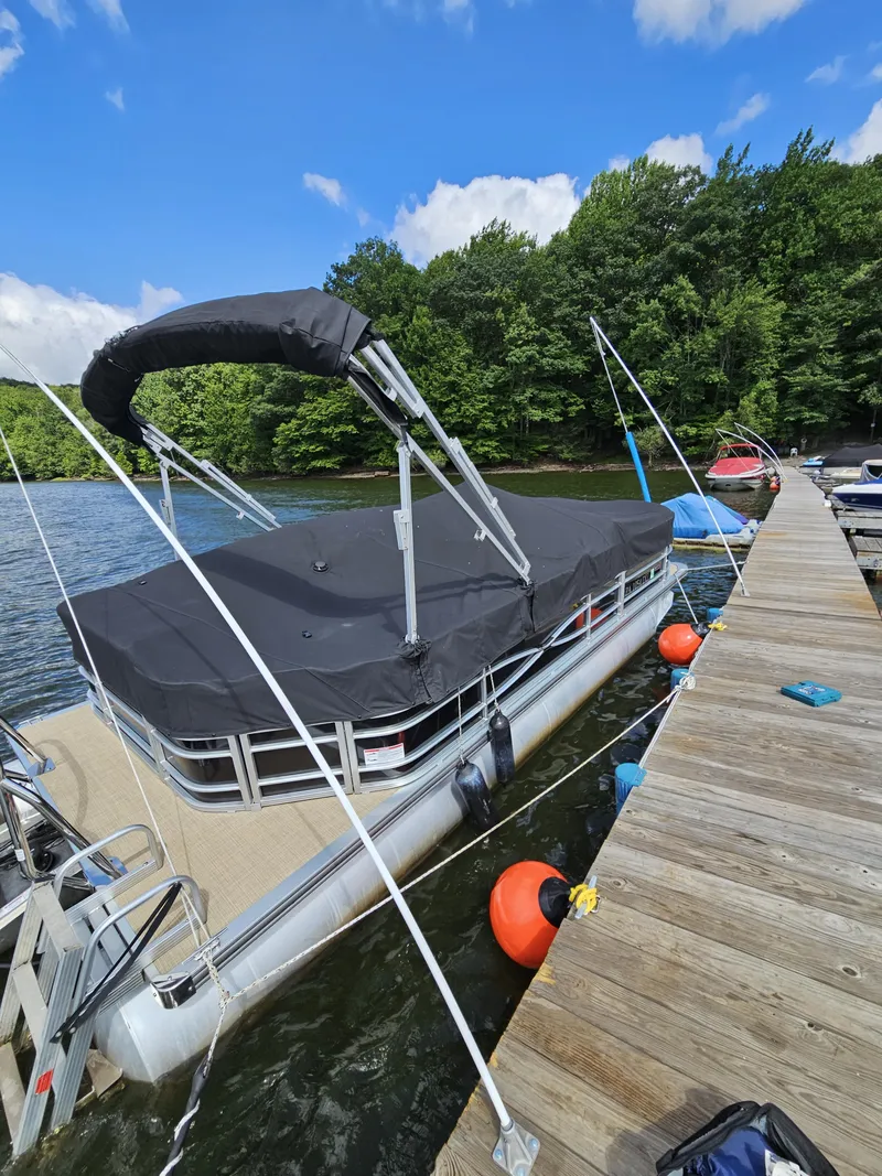 Slide: The Image of 2017 South Bay 222CR pontoon boat docked on a sunny day. - 4