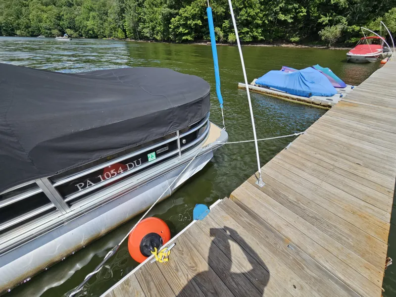 Slide: The Image of Pontoon boat South Bay 222CR, 2017, docked on a lake with wooded shoreline. - 5