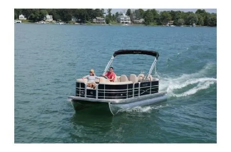 Slide: The Image of 2017 South Bay 222CR pontoon boat cruising on a lake with passengers. - 7
