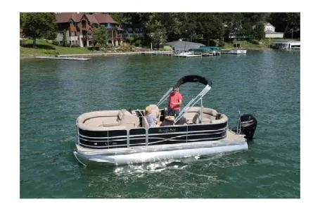 Slide: The Image of 2017 South Bay 222CR pontoon boat on a lake with scenic shoreline. - 9