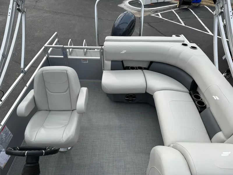 Slide: The Image of 2024 Starcraft LX 20 CB pontoon boat with spacious seating and modern design. - 11