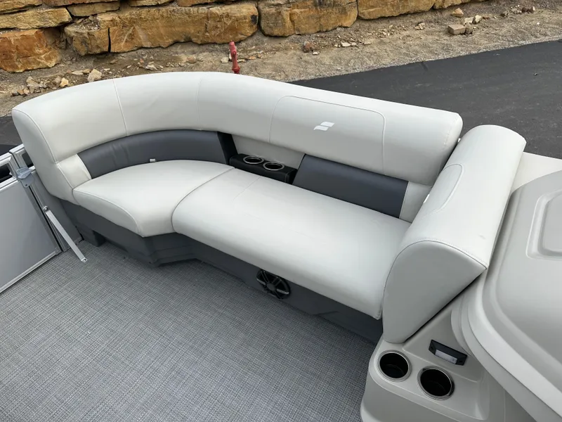 Slide: The Image of 2024 Starcraft LX 20 CB boat interior with gray seating and cup holders. - 13
