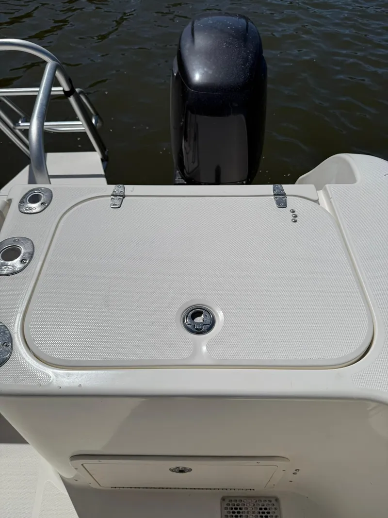 Slide: The Image of 2011 World Cat 320 EC boat stern with outboard motor and swim ladder. - 21
