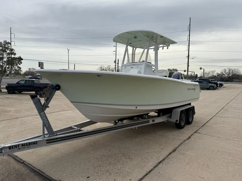 Slide: The Image of 2015 Sea Hunt 225 Ultra boat on trailer in parking lot. - 4