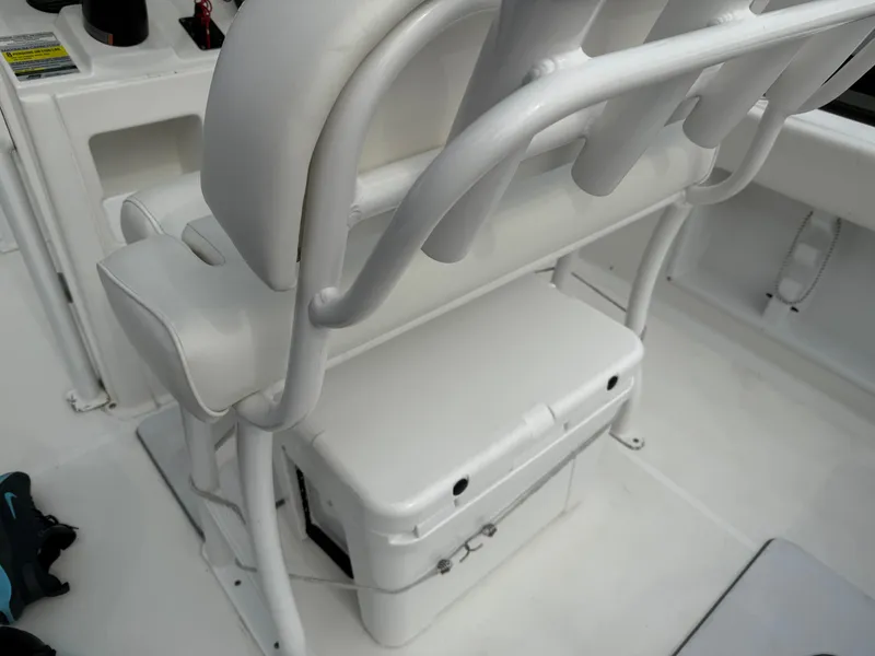 Slide: The Image of 2015 Sea Hunt 225 Ultra boat interior with white seating and storage. - 6